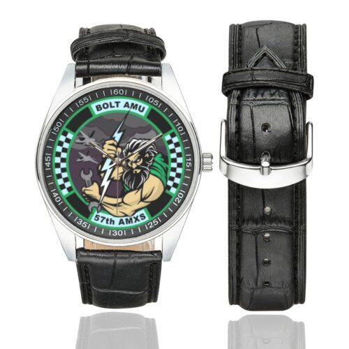 Men's casual watch with a round dial featuring the USAF 57TH AMXS BOLT AMU F-35 emblem, silver-tone case and black leather strap, shown with the strap to the side.