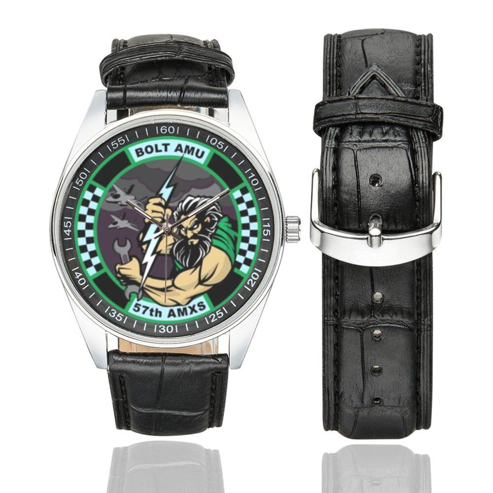 Men's casual watch with a round dial featuring the USAF 57TH AMXS BOLT AMU F-35 emblem, silver-tone case and black leather strap, shown with the strap to the side.