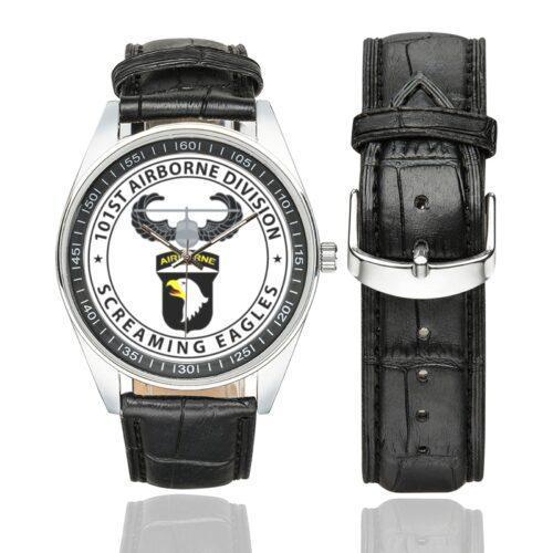 Men's casual watch with a round dial featuring the 101st Airborne Army Paratrooper emblem, silver-tone case and black leather strap, shown with the strap to the side.