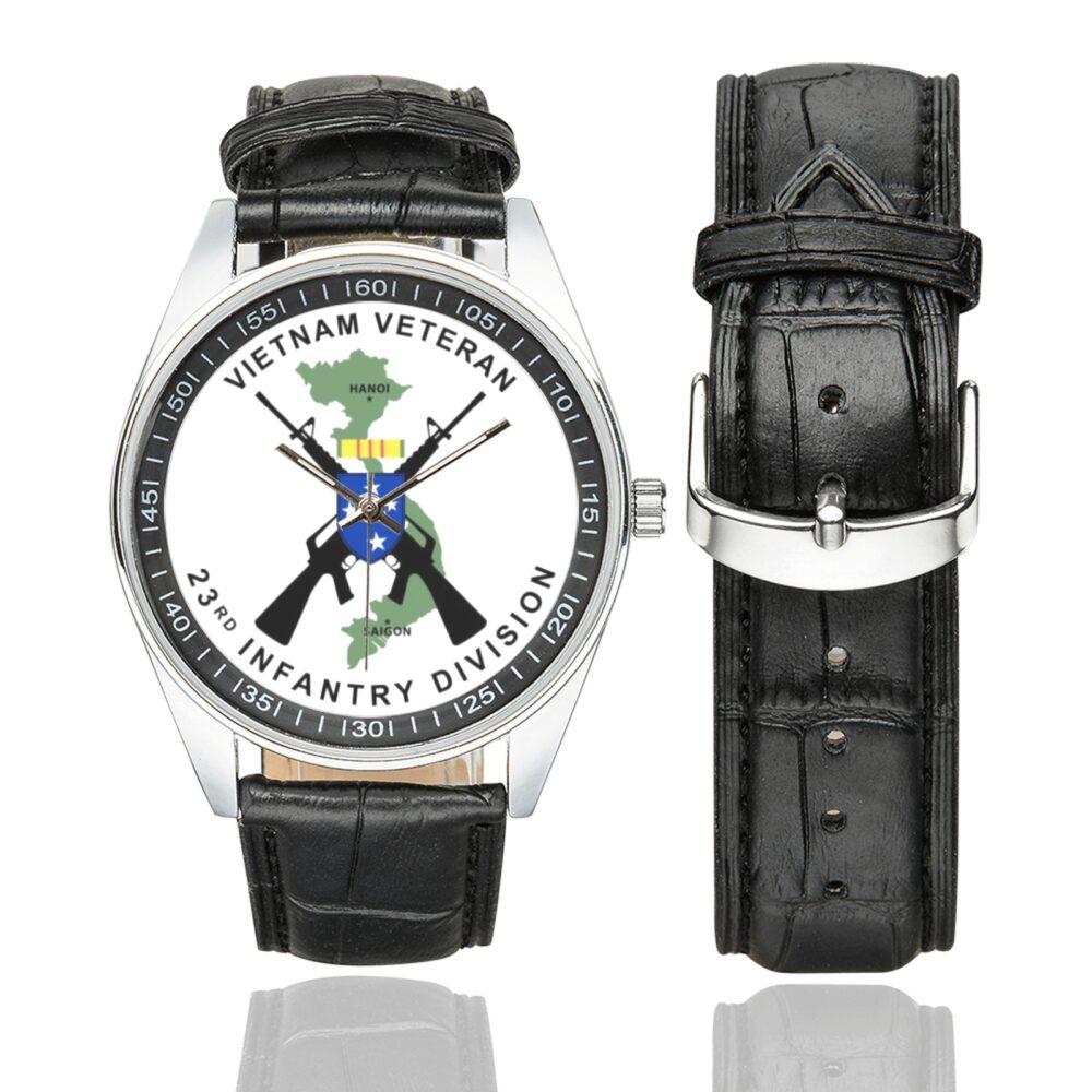 Men's casual watch with a round dial featuring the Vietnam Veteran 23rd Infantry Division emblem, silver-tone case and black leather strap, shown with the strap to the side.