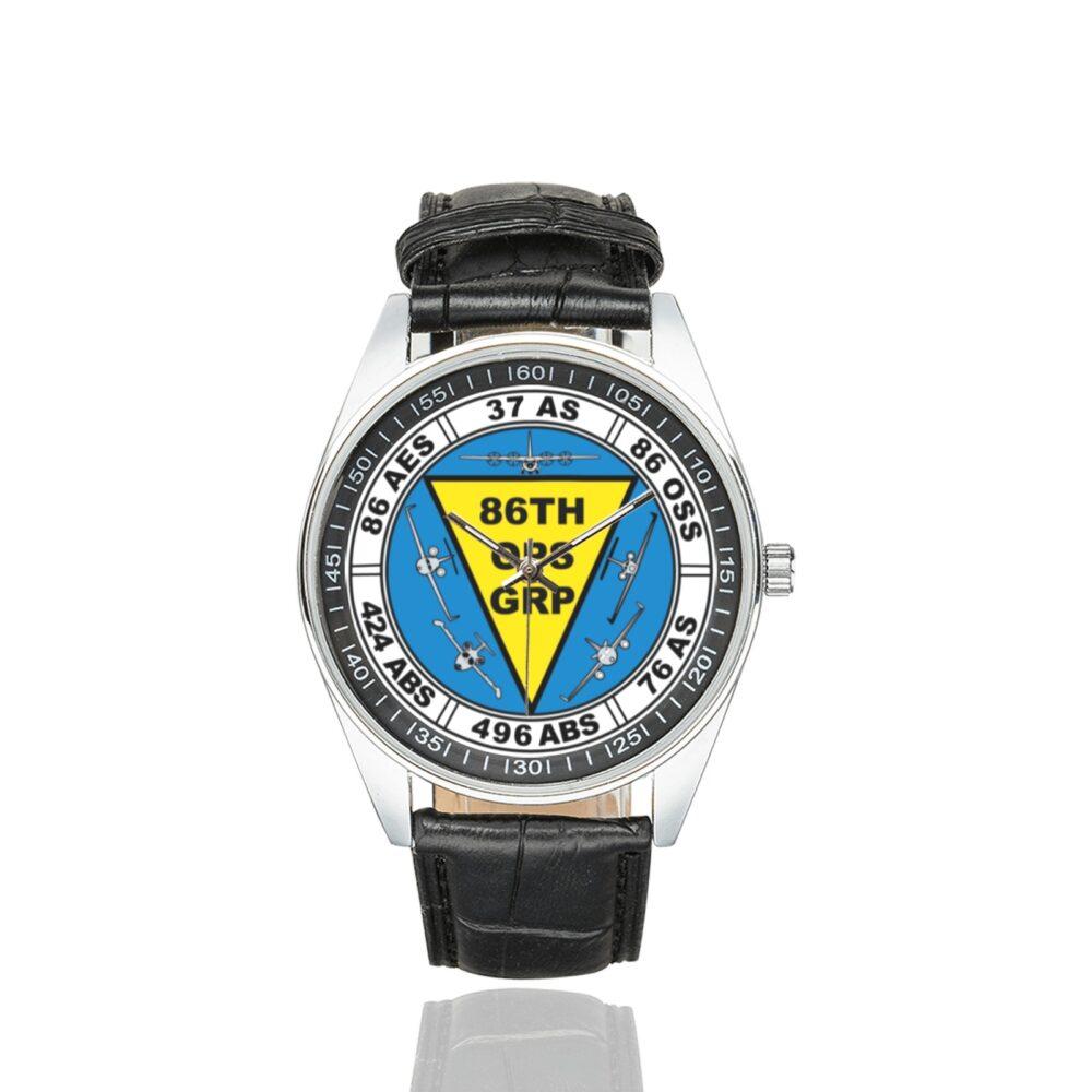 Men's casual watch with a round dial featuring the USAF 86th Operations Group emblem, silver-tone case and black leather strap.
