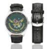 Men's casual watch with a round dial featuring the Commando Hubert emblem, silver-tone case and black leather strap, shown with the strap to the side.