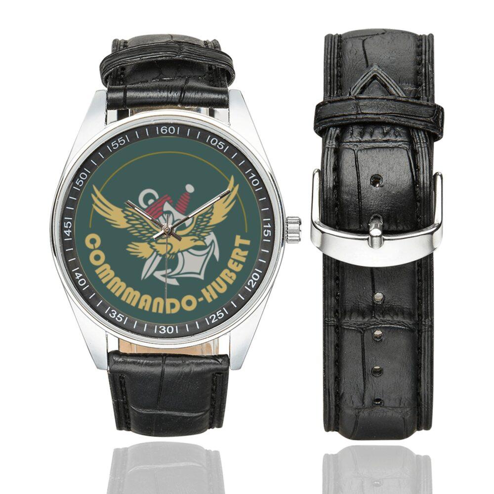 Men's casual watch with a round dial featuring the Commando Hubert emblem, silver-tone case and black leather strap, shown with the strap to the side.