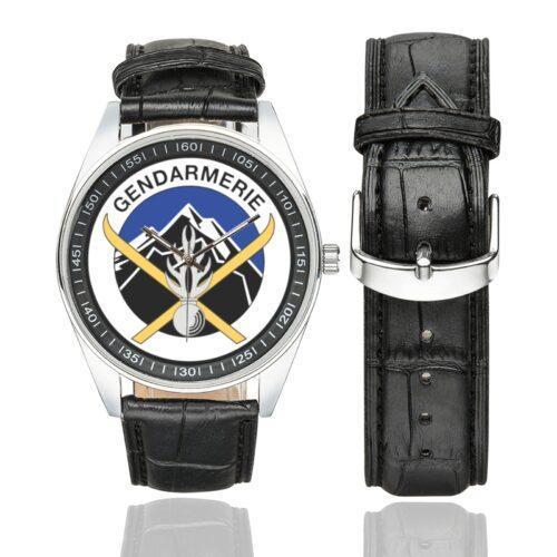 Men's casual watch with a round dial featuring the Unités de montagne Gendarmerie emblem, silver-tone case and black leather strap, shown with the strap to the side.