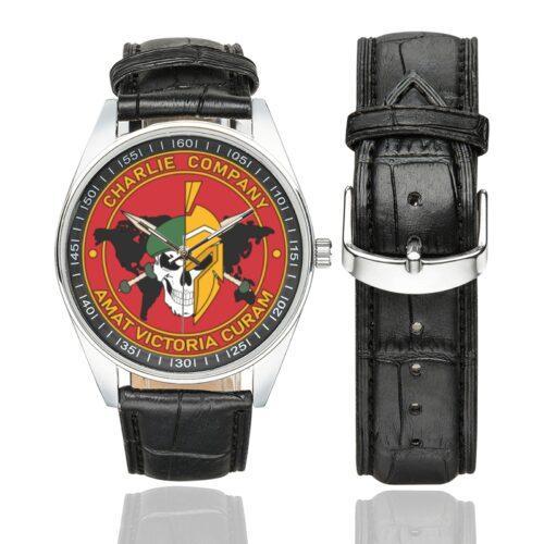 Men's casual watch with a round dial featuring the 1st Infantry Battalion International Legion Charlie company emblem, silver-tone case and black leather strap, shown with the strap to the side.