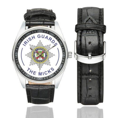 Men's casual watch with a round dial featuring the Irish Guards- The Micks emblem, silver-tone case and black leather strap, shown with the strap to the side.