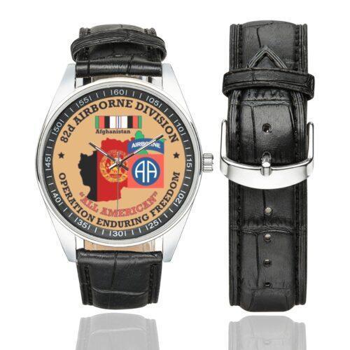 Men's casual watch with a round dial featuring the US Army 82nd Airborne Division OEF Veteran emblem, silver-tone case and black leather strap, shown with the strap to the side.