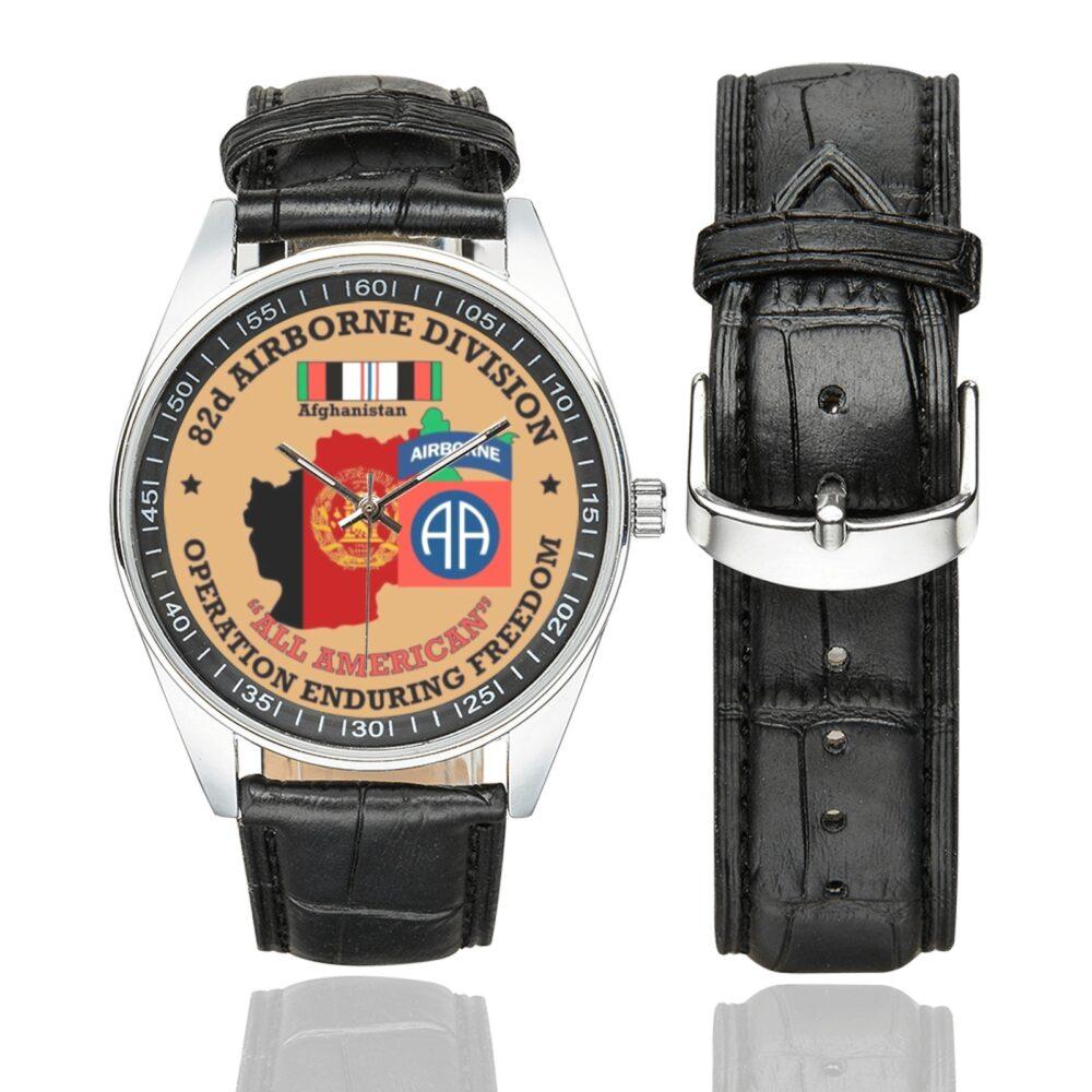 Men's casual watch with a round dial featuring the US Army 82nd Airborne Division OEF Veteran emblem, silver-tone case and black leather strap, shown with the strap to the side.