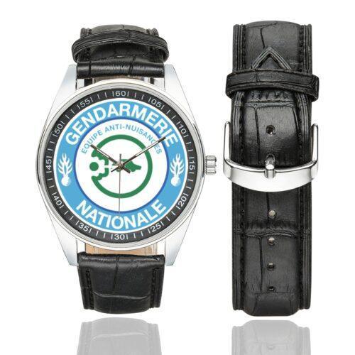 Men's casual watch with a round dial featuring the Ecusson Anti-Nuisances emblem, silver-tone case and black leather strap, shown with the strap to the side.