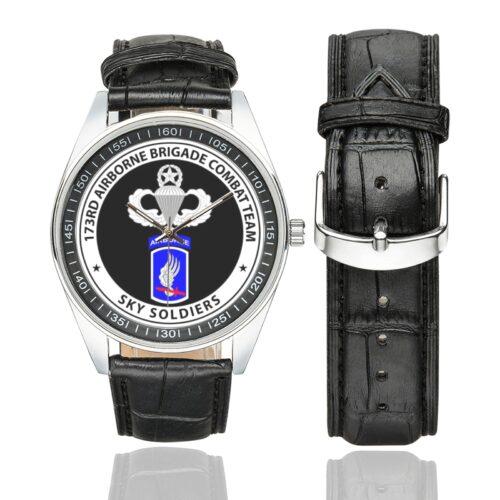 Men's casual watch with a round dial featuring the Airborne 173rd Airborne - Sky Soldiers emblem, silver-tone case and black leather strap, shown with the strap to the side.