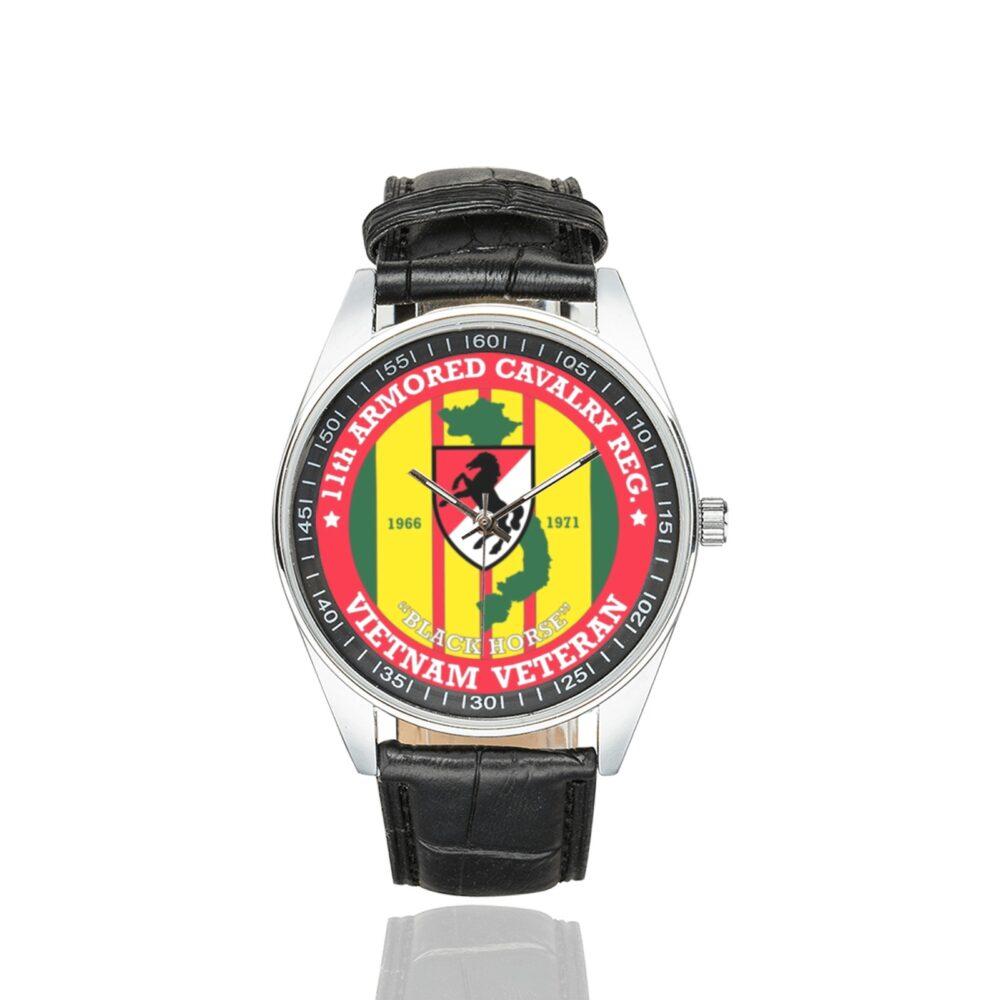 Men's casual watch with a round dial featuring the US Army 11th Armored Cavalry Regt. Vietnam emblem, silver-tone case and black leather strap.