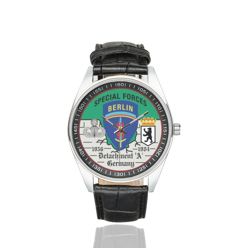 Men's casual watch with a round dial featuring the US Army Special Forces Detachment A Berlin Brigade emblem, silver-tone case and black leather strap.