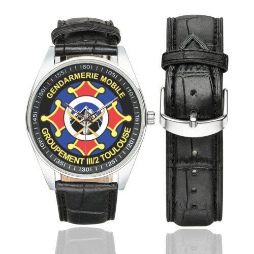 Men's casual watch with a round dial featuring the GGM III-2 emblem, silver-tone case and black leather strap, shown with the strap to the side.
