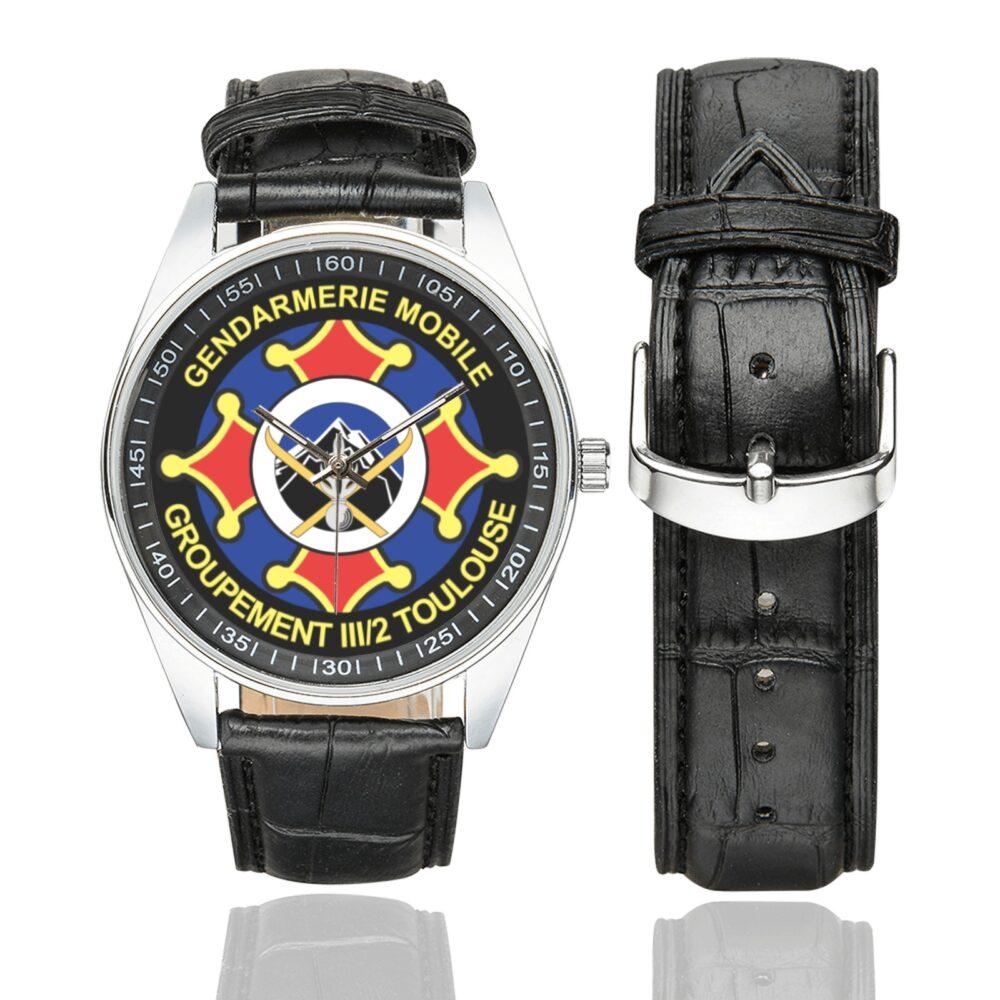 Men's casual watch with a round dial featuring the GGM III-2 emblem, silver-tone case and black leather strap, shown with the strap to the side.