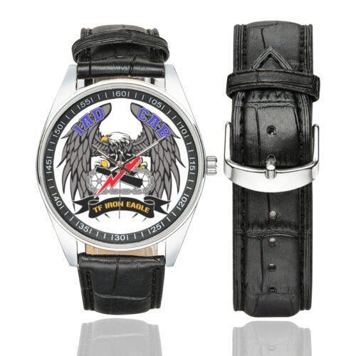 Men's casual watch with a round dial featuring the US Army 1AD Combat Aviation Brigade emblem, silver-tone case and black leather strap, shown with the strap to the side.
