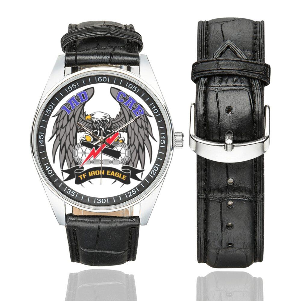 Men's casual watch with a round dial featuring the US Army 1AD Combat Aviation Brigade emblem, silver-tone case and black leather strap, shown with the strap to the side.