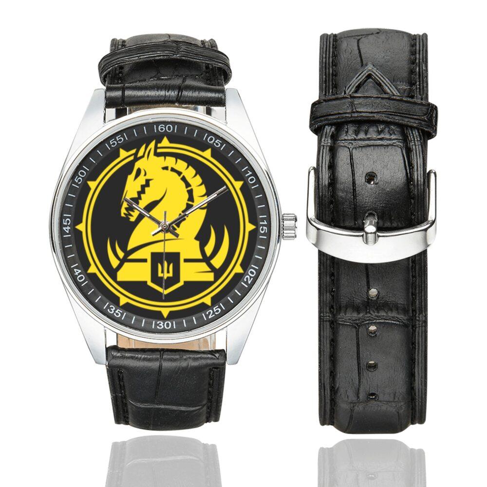 Men's casual watch with a round dial featuring the Ukraine 47th Mechanized Brigade Magura emblem, silver-tone case and black leather strap, shown with the strap to the side.