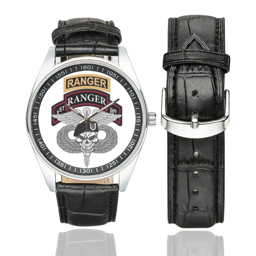 Men's casual watch with a round dial featuring the US Army 1st Ranger Battalion Medic emblem, silver-tone case and black leather strap, shown with the strap to the side.