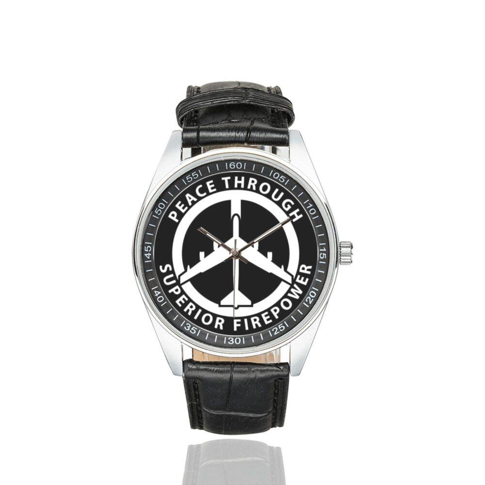 Men's casual watch with a round dial featuring the Peace Through Superior Firepower B52 Bomber emblem, silver-tone case and black leather strap.
