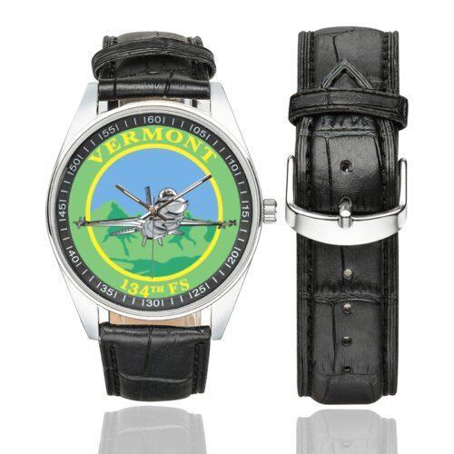 Men's casual watch with a round dial featuring the USAF 134th Fighter Squadron Vermont Air Guard emblem, silver-tone case and black leather strap, shown with the strap to the side.