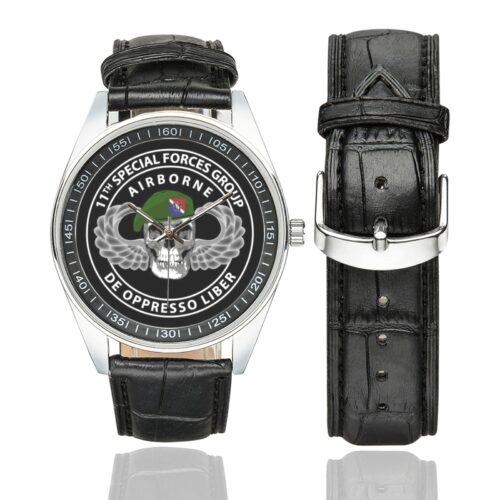 Men's casual watch with a round dial featuring the 11th Special Forces Group emblem, silver-tone case and black leather strap, shown with the strap to the side.