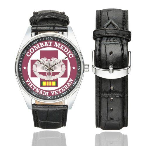 Men's casual watch with a round dial featuring the US Army Combat Medic Vietnam Veteran emblem, silver-tone case and black leather strap, shown with the strap to the side.