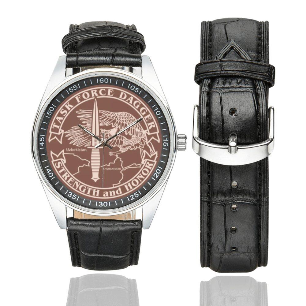 Men's casual watch with a round dial featuring the Task Force Dagger emblem, silver-tone case and black leather strap, shown with the strap to the side.