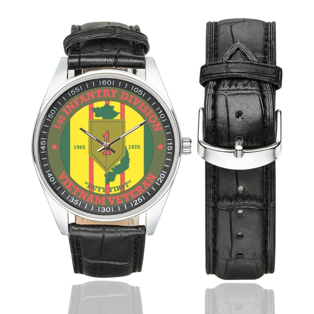 Men's casual watch with a round dial featuring the US Army 1st Infantry Division Vietnam Veteran emblem, silver-tone case and black leather strap, shown with the strap to the side.