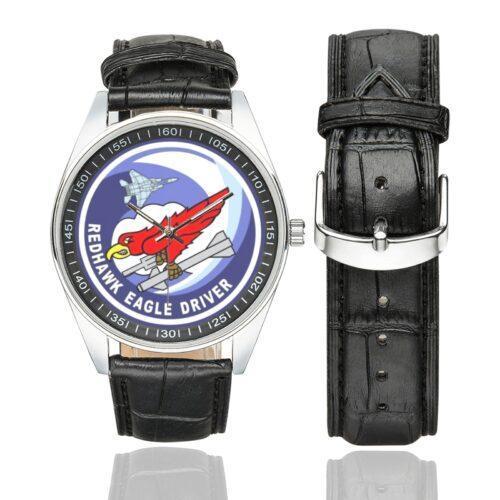 Men's casual watch with a round dial featuring the USAF 123rd Fighter Squadron Redhawk Eagle Driver emblem, silver-tone case and black leather strap, shown with the strap to the side.