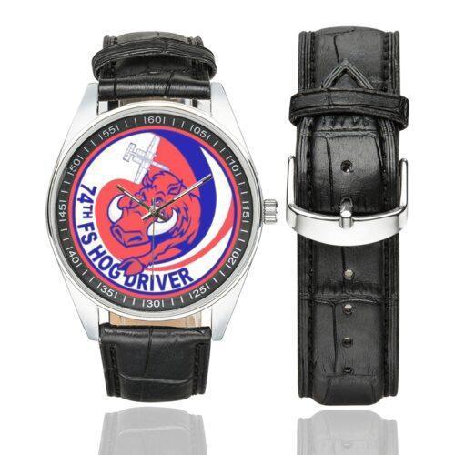 Men's casual watch with a round dial featuring the USAF 74th Fighter Squadron Hog Driver emblem, silver-tone case and black leather strap, shown with the strap to the side.
