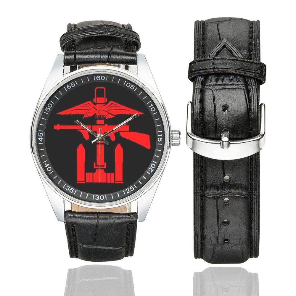 Men's casual watch with a round dial featuring the Royal Navy Commando emblem, silver-tone case and black leather strap, shown with the strap to the side.
