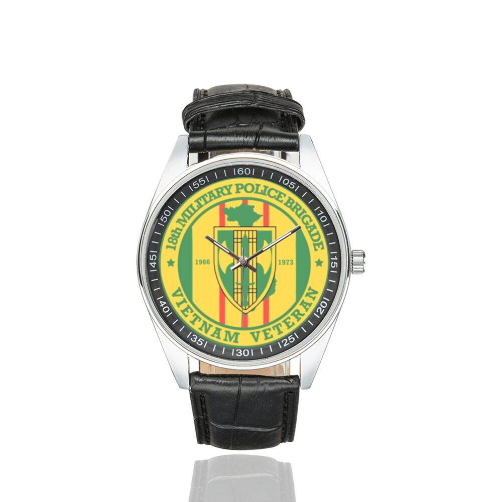 Men's casual watch with a round dial featuring the US Army 18th Military Police BDE Vietnam Veteran emblem, silver-tone case and black leather strap.