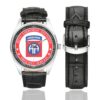 Men's casual watch with a round dial featuring the US Army 82nd Airborne Division veteran emblem, silver-tone case and black leather strap, shown with the strap to the side.
