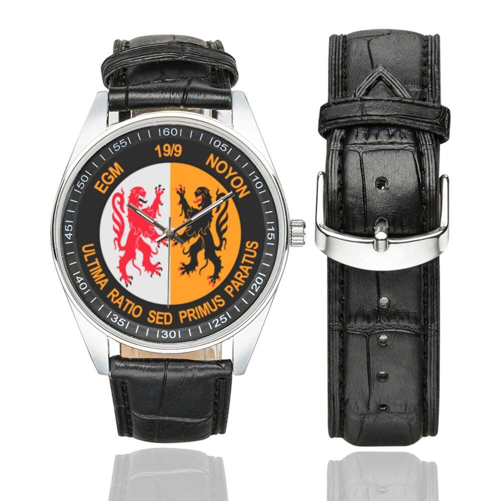 Men's casual watch with a round dial featuring the EGM 19-9 Noyon emblem, silver-tone case and black leather strap, shown with the strap to the side.
