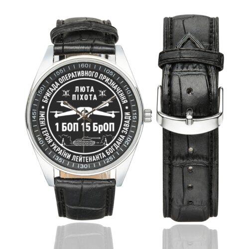 Men's casual watch with a round dial featuring the Kara-Dag Brigade 1st Battalion of Operational Assignment emblem, silver-tone case and black leather strap, shown with the strap to the side.