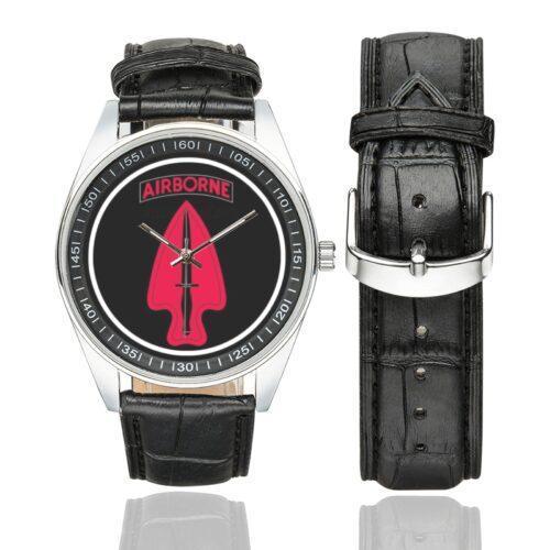 Men's casual watch with a round dial featuring the US Army 1st Special Forces Delta Force emblem, silver-tone case and black leather strap, shown with the strap to the side.