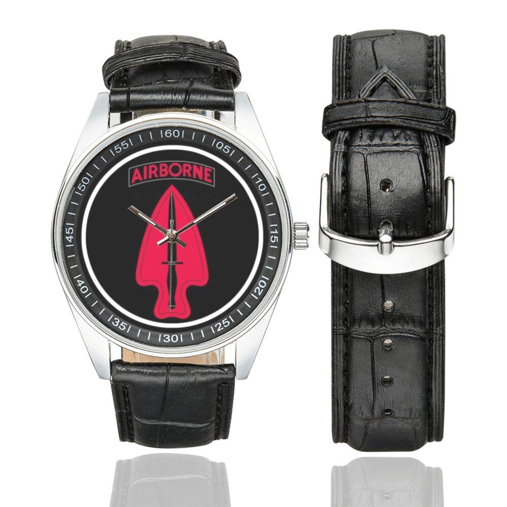 Men's casual watch with a round dial featuring the US Army 1st Special Forces Delta Force emblem, silver-tone case and black leather strap, shown with the strap to the side.