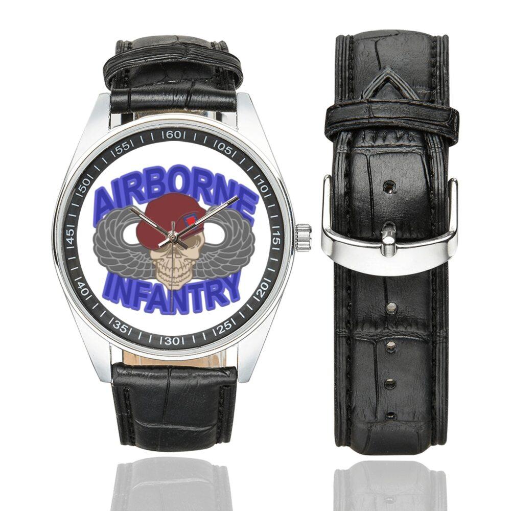 Men's casual watch with a round dial featuring the US Army Airborne Infantry emblem, silver-tone case and black leather strap, shown with the strap to the side.