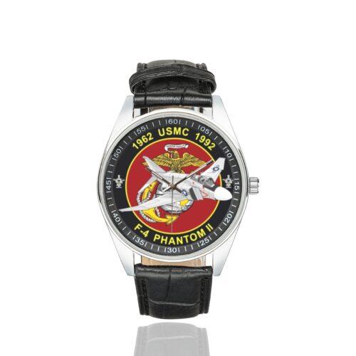Men's casual watch with a round dial featuring the USMC F-4 Phantom emblem, silver-tone case and black leather strap.