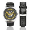 Men's casual watch with a round dial featuring the Commando Marine Hubert emblem, silver-tone case and black leather strap, shown with the strap to the side.