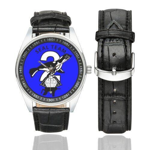 Men's casual watch with a round dial featuring the SEAL Team 2 emblem, silver-tone case and black leather strap, shown with the strap to the side.