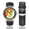 Men's casual watch with a round dial featuring the US Army 1st Cavalry Division Veteran emblem, silver-tone case and black leather strap, shown with the strap to the side.