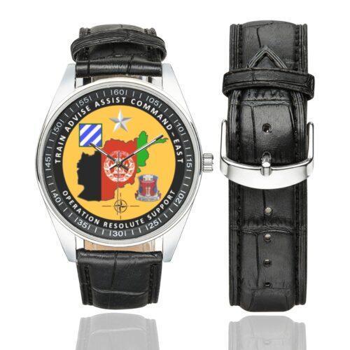 Men's casual watch with a round dial featuring the Operation Resolute Support Task Force Southeast Afghanistan emblem, silver-tone case and black leather strap, shown with the strap to the side.