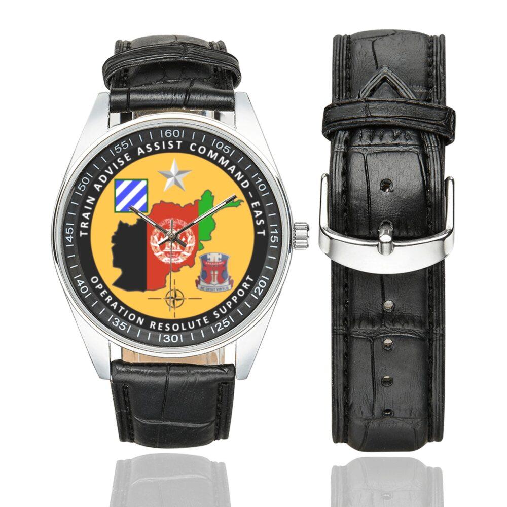 Men's casual watch with a round dial featuring the Operation Resolute Support Task Force Southeast Afghanistan emblem, silver-tone case and black leather strap, shown with the strap to the side.