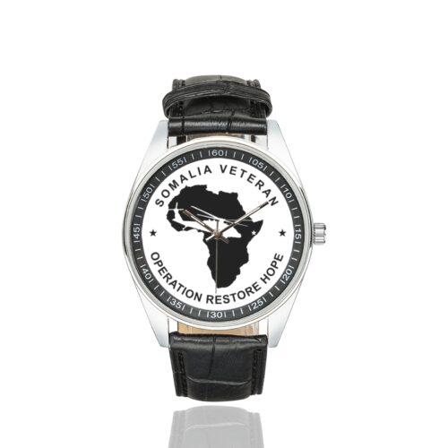 Men's casual watch with a round dial featuring the Somalia Veteran2 emblem, silver-tone case and black leather strap.