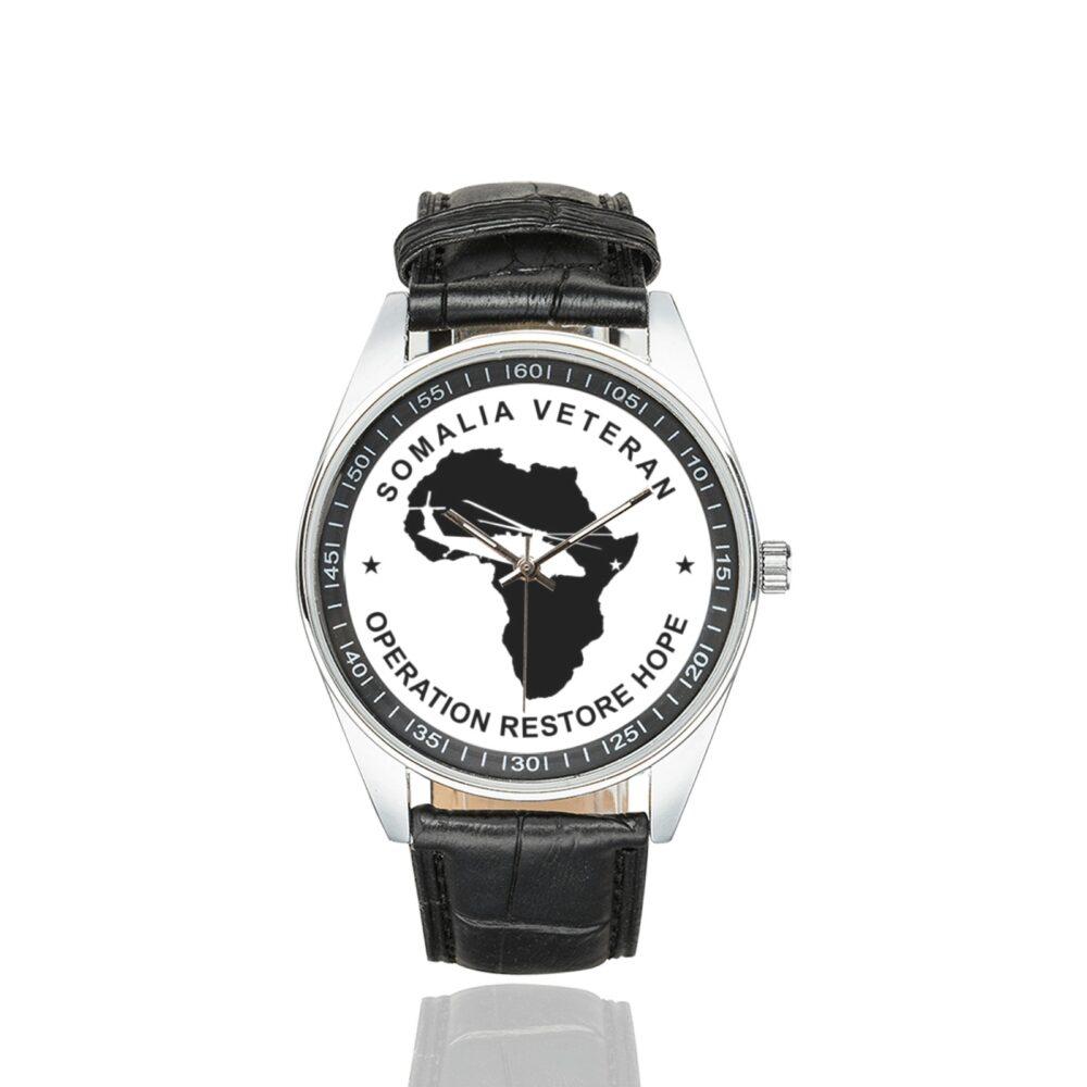 Men's casual watch with a round dial featuring the Somalia Veteran2 emblem, silver-tone case and black leather strap.