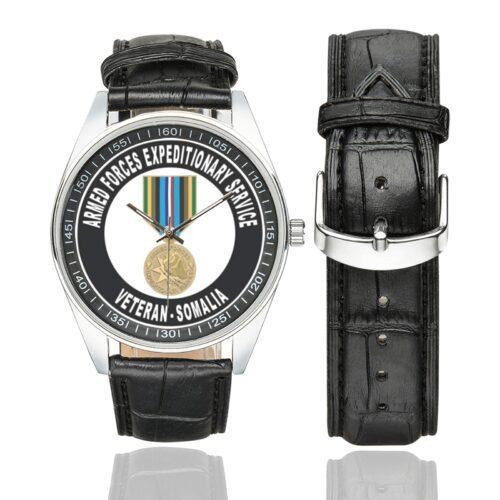 Men's casual watch with a round dial featuring the Armed Forces Expeditionary Service Somalia emblem, silver-tone case and black leather strap, shown with the strap to the side.