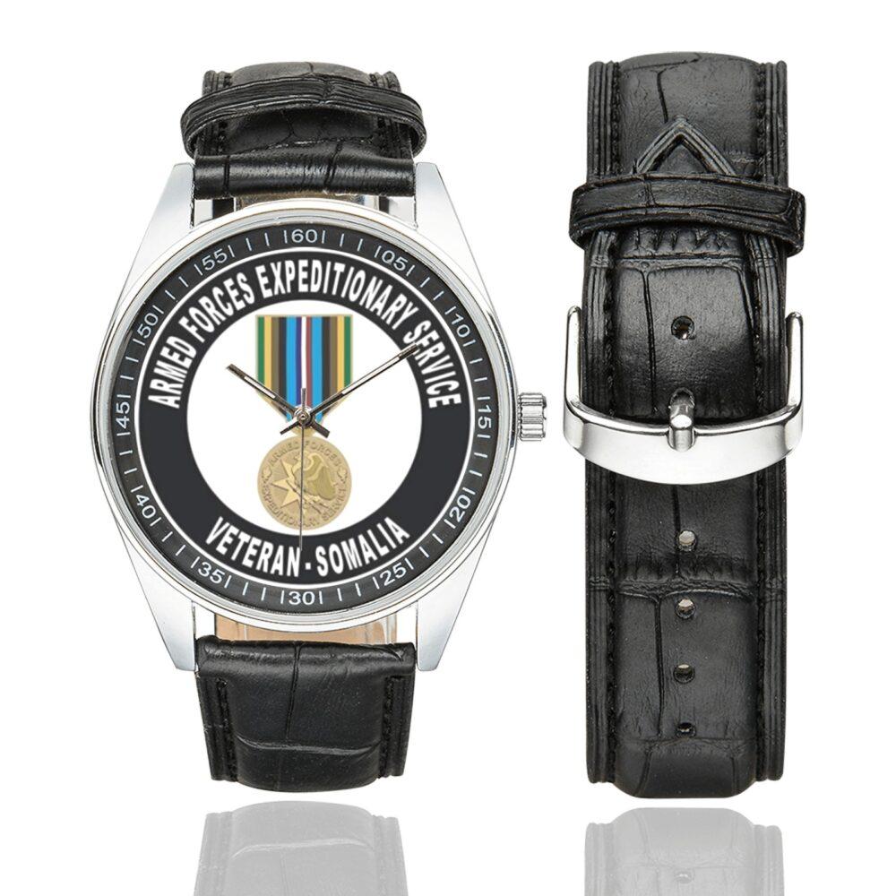 Men's casual watch with a round dial featuring the Armed Forces Expeditionary Service Somalia emblem, silver-tone case and black leather strap, shown with the strap to the side.