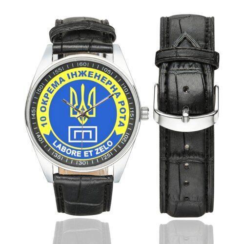 Men's casual watch with a round dial featuring the 10th Separate Engineering Company emblem, silver-tone case and black leather strap, shown with the strap to the side.