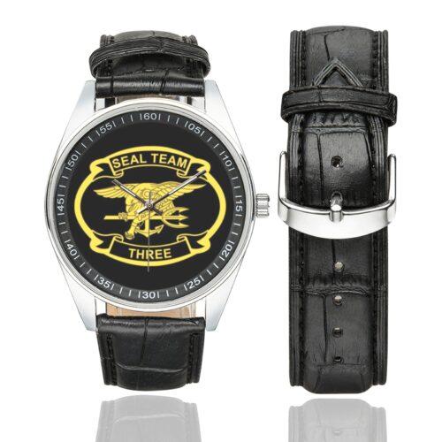 Men's casual watch with a round dial featuring the SEAL Team 3 emblem, silver-tone case and black leather strap, shown with the strap to the side.